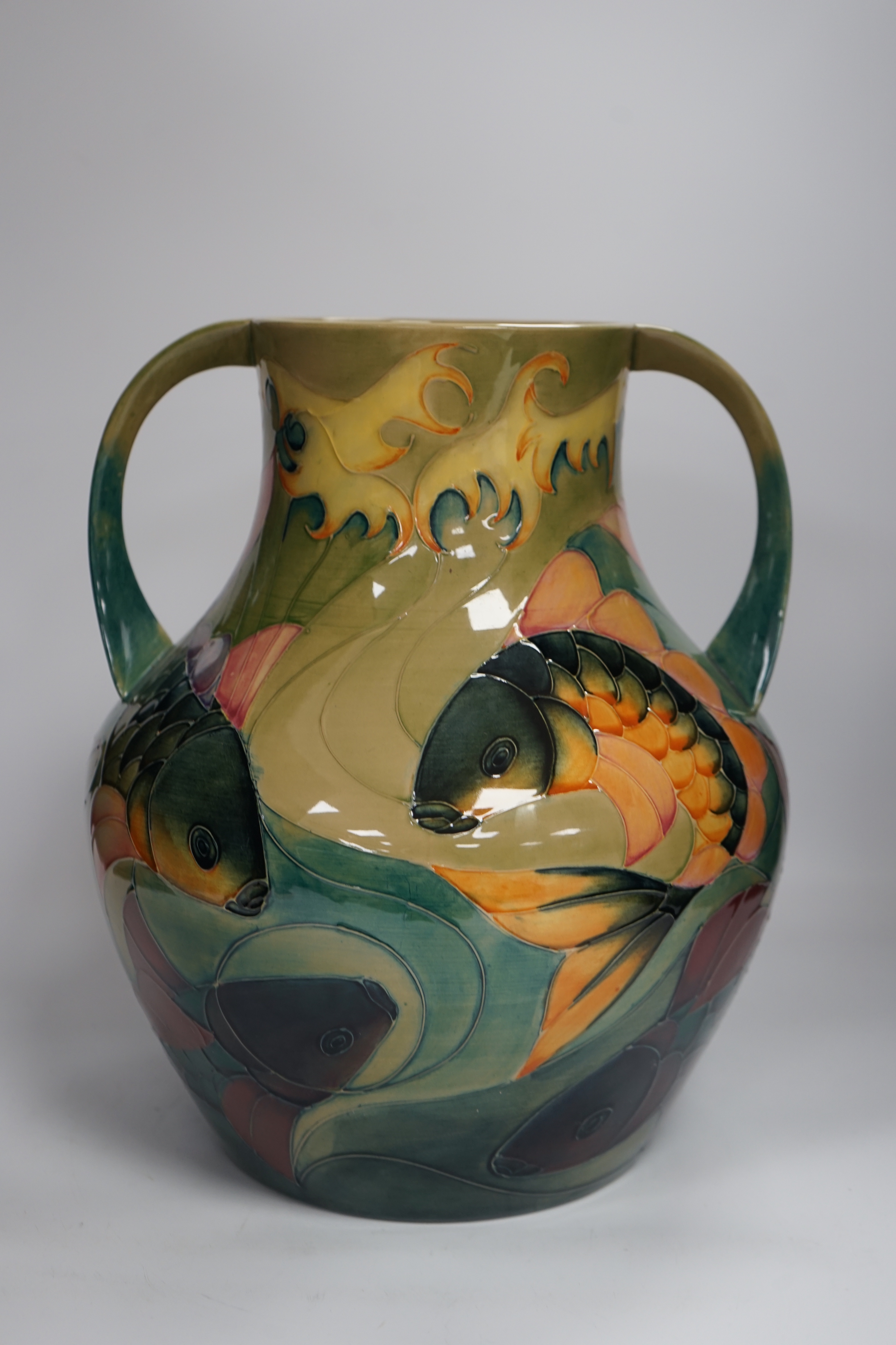 A large Moorcroft twin-handled 'carp' vase, designed by Sally Tuffin, 33cm high